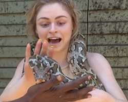 She is an animal lover and doesn't afraid to hold even a big python.